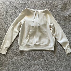 cream colored pullover hoodie